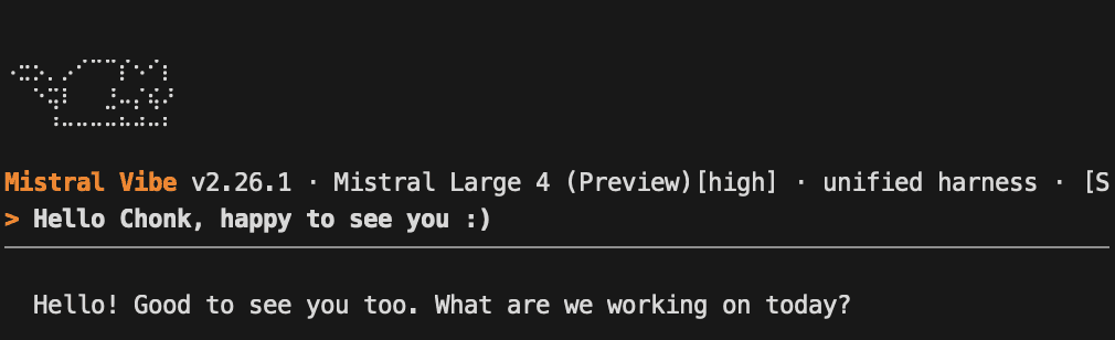 The Mistral Vibe 2.26.1 CLI with Mistral Large 4 (Preview) selected, answering "Hello! Good to see you too"